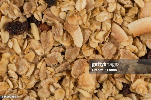 closeup of a pile of muesli cereal breakfast oatmeal - raisin bran stock pictures, royalty-free photos & images