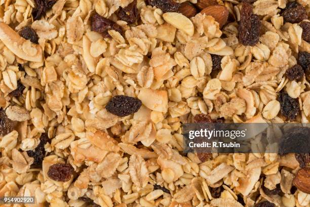 closeup of a pile of muesli cereal breakfast oatmeal - raisin bran stock pictures, royalty-free photos & images