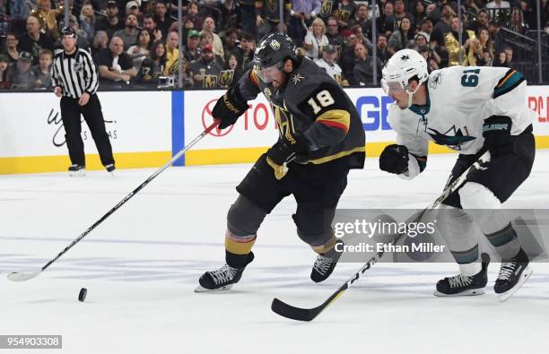 James Neal of the Vegas Golden Knights skates with the puck against Justin Braun of the San Jose Sharks in the second period of Game Five of the...