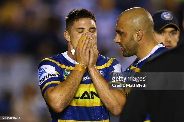 Mitchell Moses of the Eels shows his emotion after missing a kick conversion at full time alongside Tim Mannah of the Eels after the round nine NRL...
