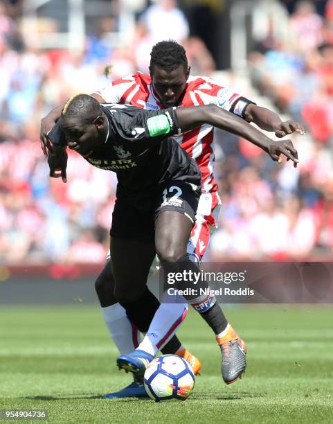 Mame Biram Diouf of Stoke City and Mamadou Sakho of Crystal Palace battle for the ball during the Premier League match between Stoke City and Crystal...