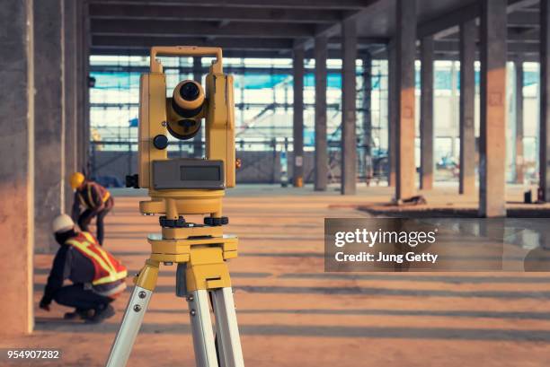 survey equipment in construction site - land surveyor stock pictures, royalty-free photos & images
