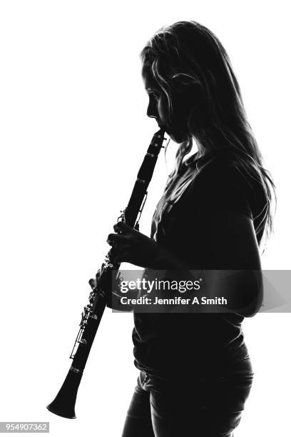 silhouette of clarinetist - 木管楽器 ストックフォトと画像