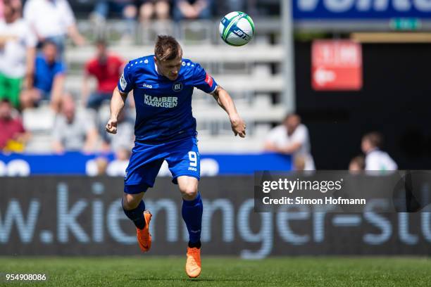 Marvin Pourie of Karlsruhe scores his team's first goal with a header during the 3. Liga match between VfR Aalen and Karlsruher SC at Ostalb Arena on...