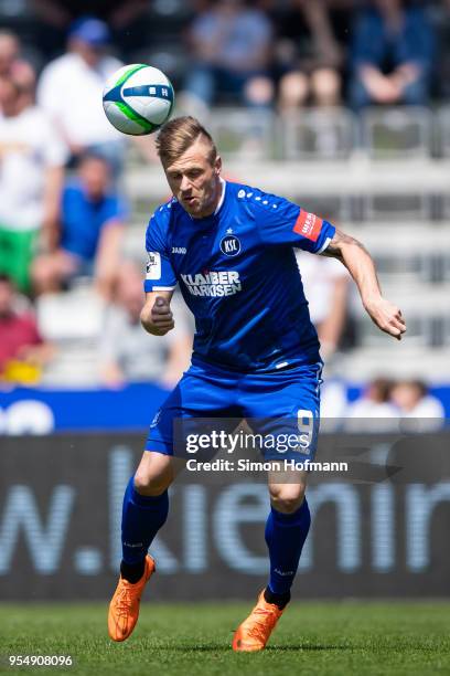 Marvin Pourie of Karlsruhe scores his team's first goal with a header during the 3. Liga match between VfR Aalen and Karlsruher SC at Ostalb Arena on...