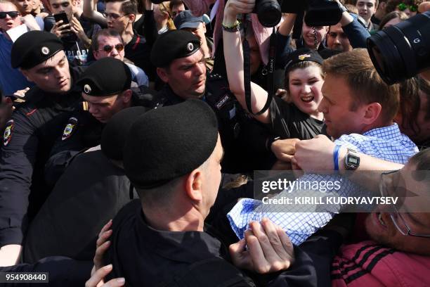 Russian riot police officers detain opposition leader Alexei Navalny during an unauthorized anti-Putin rally on May 5, 2018 in Moscow, two days ahead...