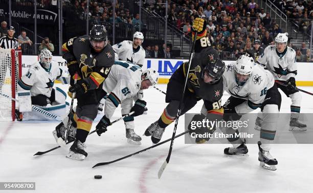 James Neal of the Vegas Golden Knights, Justin Braun of the San Jose Sharks, Nate Schmidt of the Golden Knights and Eric Fehr of the Sharks fight for...