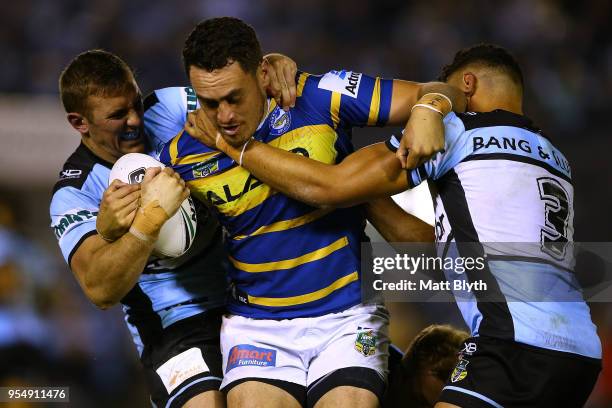 Bradley Takairangi of the Eels is tackled during the round nine NRL match between the Cronulla Sharks and the Parramatta Eels at Southern Cross Group...