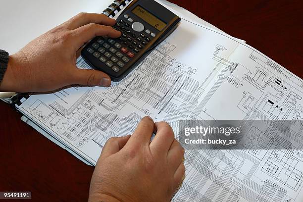 engineer calculating on diagram - calculations bildbanksfoton och bilder