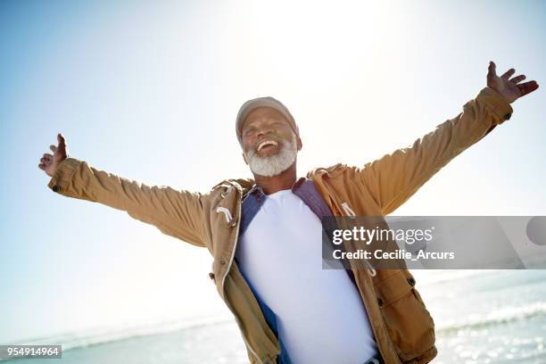 welcoming the sunny side of retirement - man cheering stock pictures, royalty-free photos & images