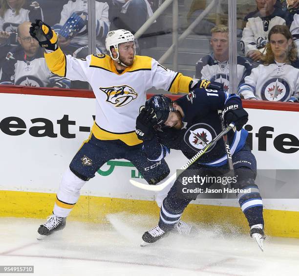 Colton Sissons of the Nashville Predators checks Bryan Little of the Winnipeg Jets in Game Four of the Western Conference Second Round during the...