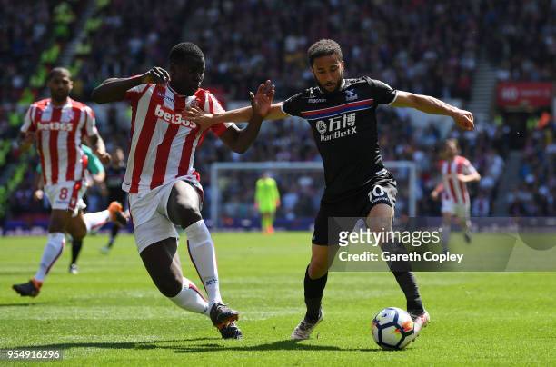 Kurt Zouma of Stoke City and Andros Townsend of Crystal Palace battle for possession during the Premier League match between Stoke City and Crystal...