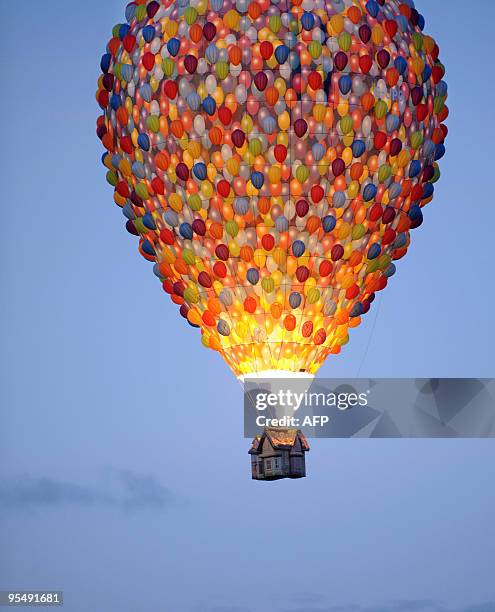 A hot-air balloon shaped like the house from the cartoon movie A hot-air balloon shaped like the house from the cartoon movie