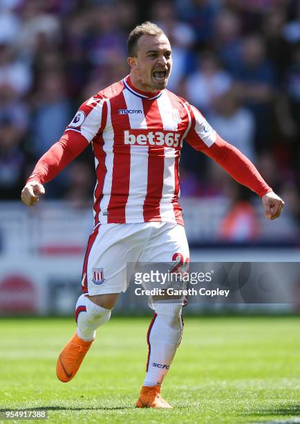 Xherdan Shaqiri of Stoke City celebrates after scoring his sides first goal during the Premier League match between Stoke City and Crystal Palace at...