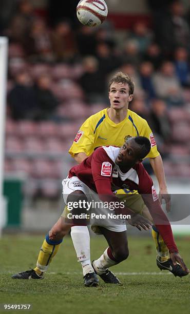 Courtney Herbert of Northampton Town looks for the ball with Scott Doe of Dagenham & Redbridge during the Coca Cola League Two Match between...