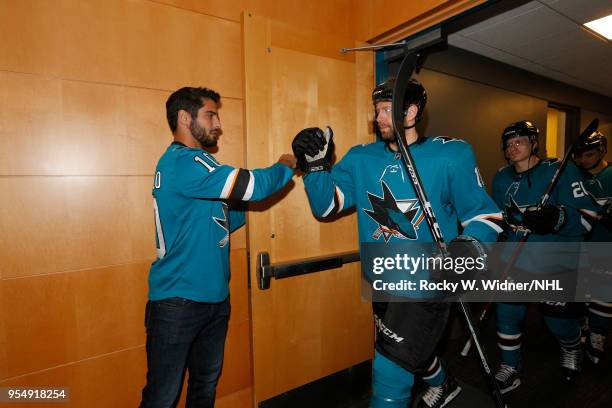 Jimmy Garoppolo of the San Francisco 49ers greets Eric Fehr of the San Jose Sharks prior to the game against the Vegas Golden Knights in Game Three...