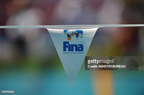 The logo of the Swimming governing body FINA is displayed on a flag at the main swimming pool on July 26, 2009 at the 13th FINA World Swimming...