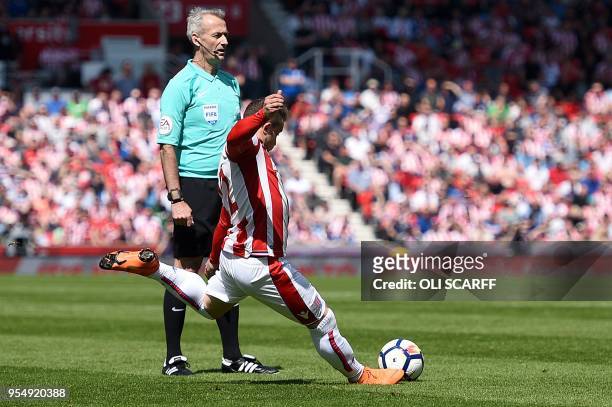 Stoke City's Swiss forward Xherdan Shaqiri takes a free kick to score the opening goal during the English Premier League football match between Stoke...