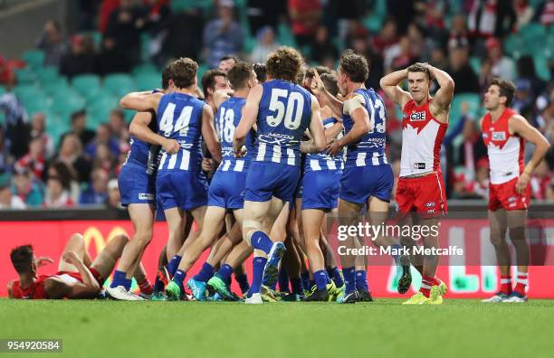 Kangaroos players celebrate victory in the round seven AFL match between the Sydney Swans and the North Melbourne Kangaroos at Sydney Cricket Ground...