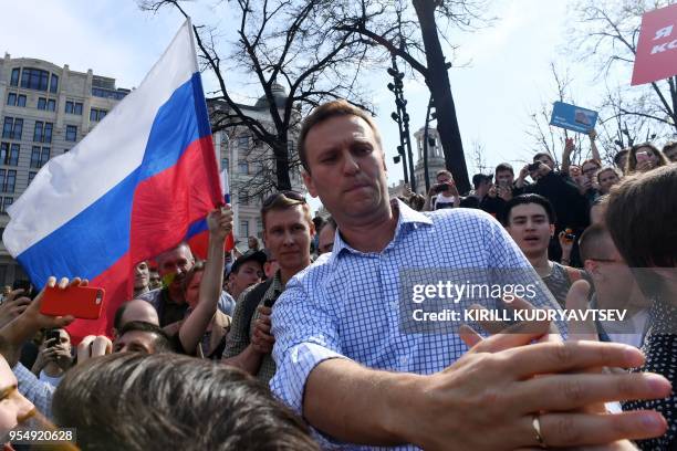 Russian opposition leader Alexei Navalny greets supporters during an unauthorized anti-Putin rally on May 5, 2018 in Moscow, two days ahead of...