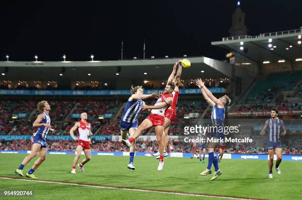 Players compete for a mark during the round seven AFL match between the Sydney Swans and the North Melbourne Kangaroos at Sydney Cricket Ground on...