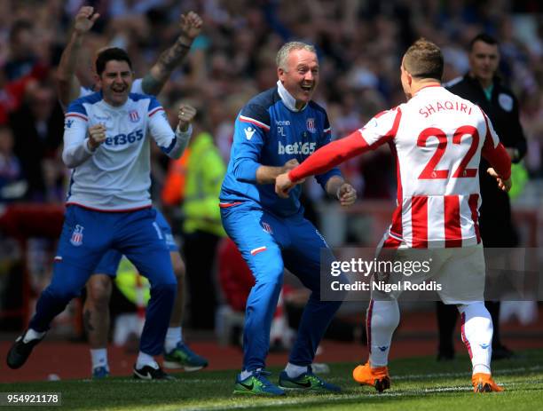 Xherdan Shaqiri of Stoke City celebrates with Paul Lambert, Manager of Stoke City after scoring his sides first goal during the Premier League match...