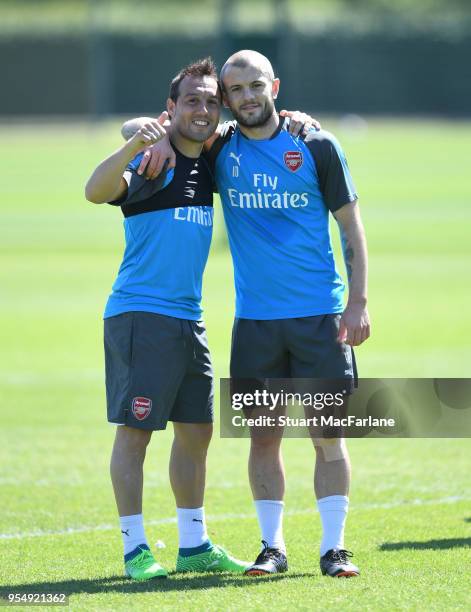 Santi Cazorla and Jack Wilshere of Arsenal during a training session at London Colney on May 5, 2018 in St Albans, England.