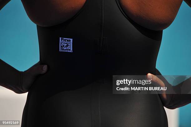 Swimmer wears an approved swimsuit with the logo of the swimming governing body FINA on July 26, 2009 at the 13th FINA World Swimming Championships...