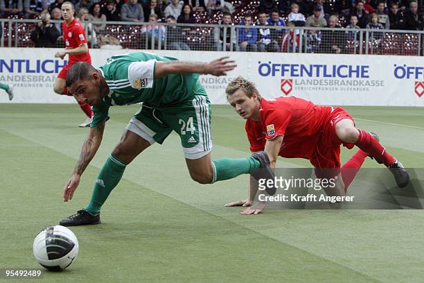 Ashkan Dejagah of Wolfsburg and Claus Costa of Duesseldorf battle for the ball during the Indoor Football Cup match between VFL Wolfsburg and Fortuna...