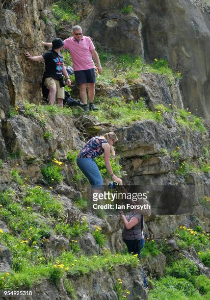 Spectators climb to a vantage spot as they gather on the iconic Sutton Bank waiting for the third stage of the Tour de Yorkshire cycling race to...