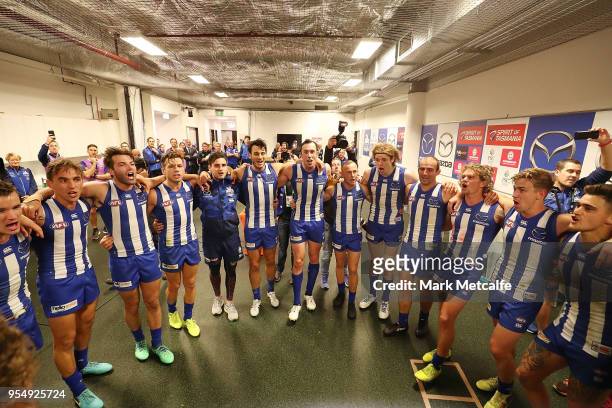Kangaroos players celebrate victory by singing the team song after the round seven AFL match between the Sydney Swans and the North Melbourne...