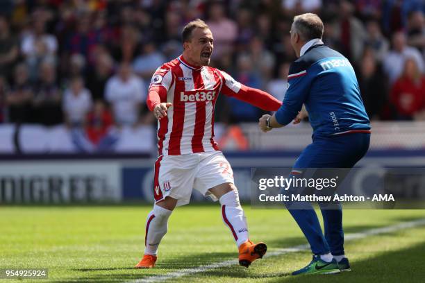 Xherdan Shaqiri of Stoke City celebrates after scoring a goal to make it 1-0 with head coach / manager Paul Lambert during the Premier League match...