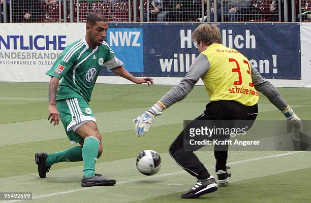 Ashkan Dejagah of Wolfsburg shoots against goalkeeper Maximilian Niehues of Duesseldorf during the Indoor Football Cup match between VFL Wolfsburg...