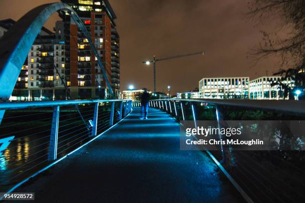 leeds out of focus person walking over a bridge - leeds station stock pictures, royalty-free photos & images