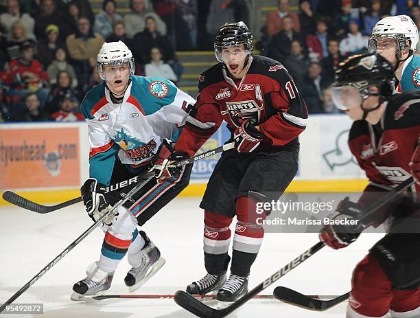 Mitchell Chapman of the Kelowna Rockets checks Craig Cunningham of the Vancouver Giants at the Kelowna Rockets at Prospera Place on December 27, 2009...