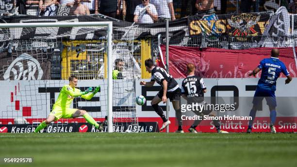David Pisot of Karlsruhe tries to score against goalkeeper Daniel Bernhardt of Aalen during the 3. Liga match between VfR Aalen and Karlsruher SC at...