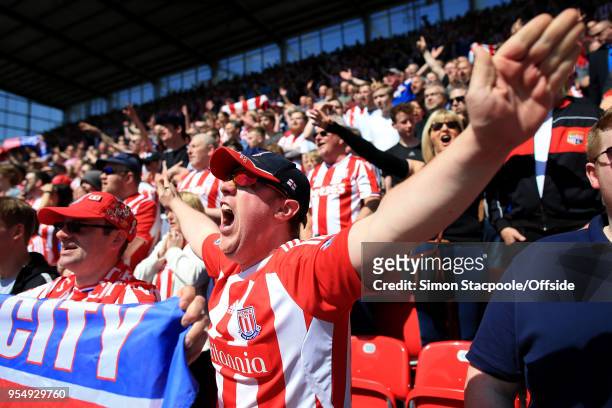 Stoke fans cheer on their side during the Premier League match between Stoke City and Crystal Palace at the Bet365 Stadium on May 5, 2018 in...