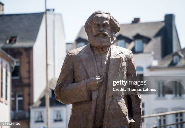 The sculpture of German philosopher and revolutionary Karl Marx is uncovered during its inauguration at the 200th anniversary of the birth of Karl...