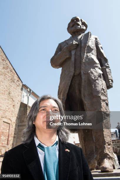 The Chinese artist Wu Weishan pictured in front of his sculpture of German philosopher and revolutionary Karl Marx after the inauguration at the...
