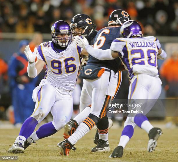 Brian Robison and Madieu Williams of the Minnesota Vikings sack Jay Cutler of the Chicago Bears during an NFL Monday night game against the Chicago...