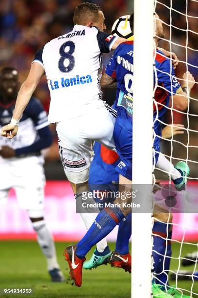 Besart Berisha of Melbourne Victory and Roy O'Donovan of the Jets compete for the ball in front of goal during the 2018 A-League Grand Final match...