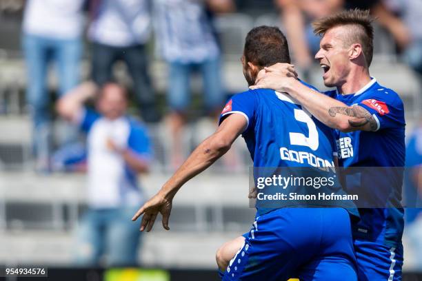 Daniel Gordon of Karlsruhe celebrates his team's second goal with team mate Marvin Pourie during the 3. Liga match between VfR Aalen and Karlsruher...