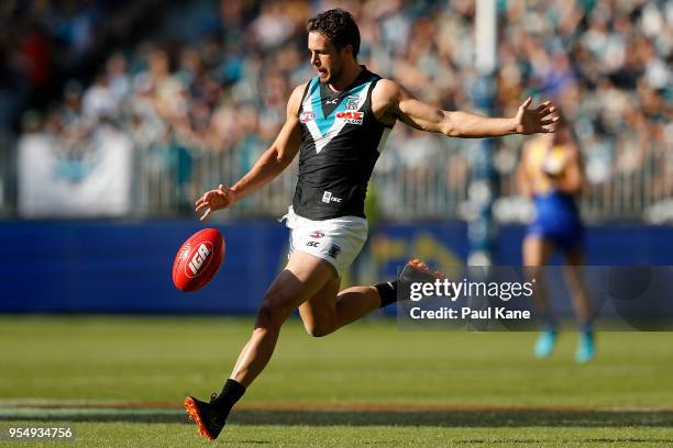 Travis Boak of the Power passes the ball during the round seven AFL match between the West Coast Eagles and the Port Adelaide Power at Optus Stadium...