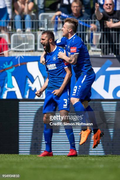 Daniel Gordon of Karlsruhe celebrates his team's second goal with team mate Marvin Pourie during the 3. Liga match between VfR Aalen and Karlsruher...