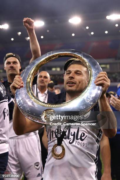 Kosta Barbarouses of the Victory celebrates winning the 2018 A-League Grand Final match between the Newcastle Jets and the Melbourne Victory at...