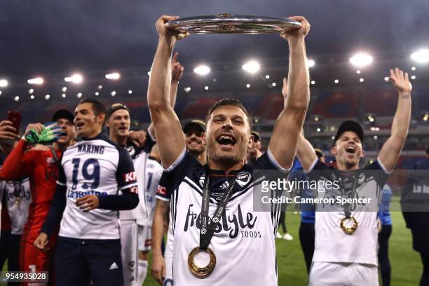 Kosta Barbarouses of the Victory celebrates winning the 2018 A-League Grand Final match between the Newcastle Jets and the Melbourne Victory at...