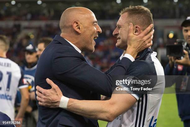 Besart Berisha and Kevin Muscat of the Victory celebrate the win over the Jets during the 2018 A-League Grand Final match between the Newcastle Jets...