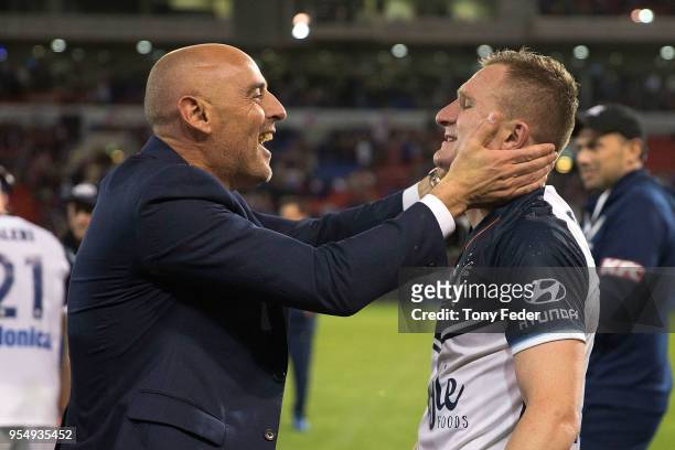 Besart Berisha and Kevin Muscat of the Victory celebrate the win over the Jets during the 2018 A-League Grand Final match between the Newcastle Jets...