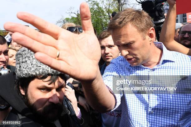 Opposition leader Alexei Navalny speaks to pro-Kremlin activists during an unauthorized anti-Putin rally on May 5, 2018 in Moscow, two days ahead of...