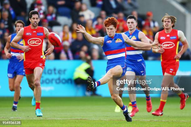 Ed Richards of the Bulldogs kicks the ball during the round seven AFL match between the Western Bulldogs and the Gold Coast Suns at Mars Stadium on...